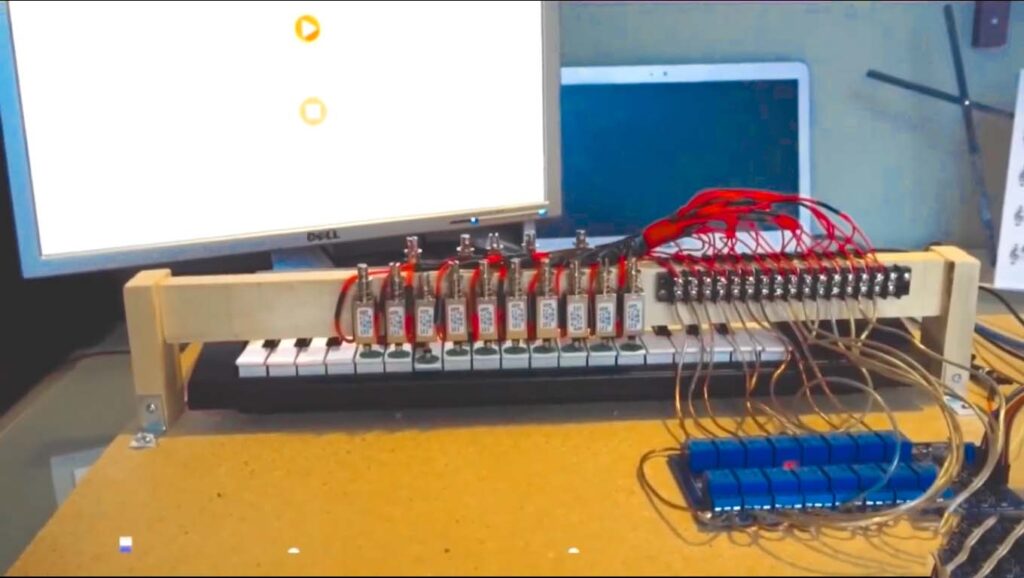 Raspberry Pi piano playing robot